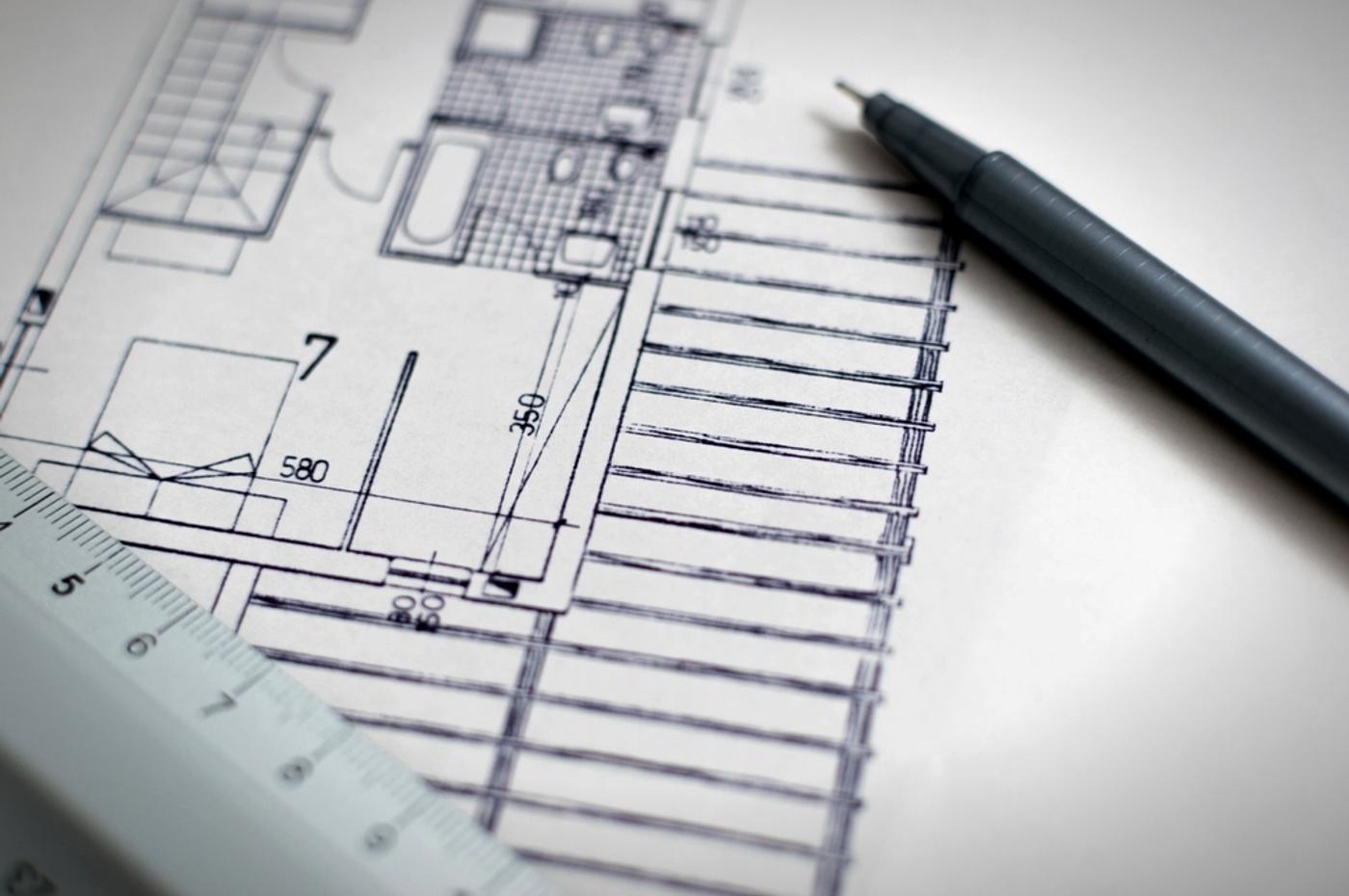 Civil and architectural drawings with a scale ruler and pen
